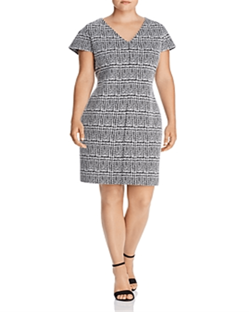 Front of a model wearing a size 3X Michael Kors Women's Plus Jacquard Plaid Bodycon Dress Black Size 3X in Black by Michael Kors. | dia_product_style_image_id:313038